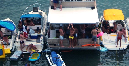 shirtless guys on boats